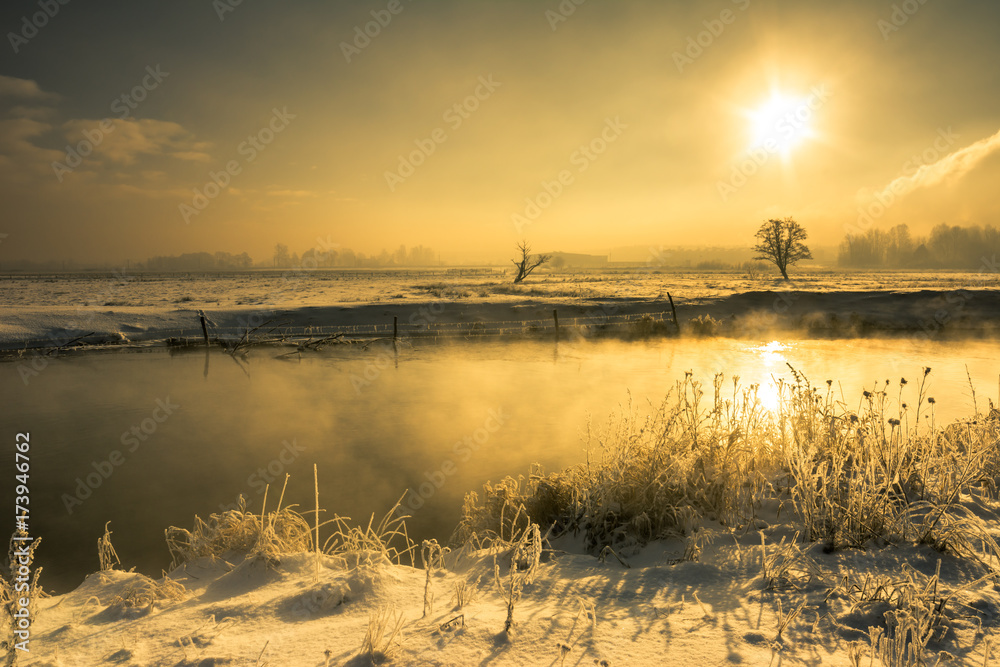 Fototapeta premium Winter river, landscape, morning sun glare in the water