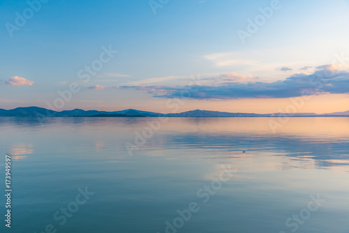 sunset over Lake Trasimeno in Umbria, with rippled water