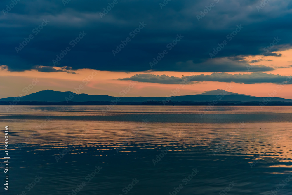 sunset over Lake in Umbria Italy