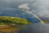rainbow in Scotland on the bay of the island of Skye