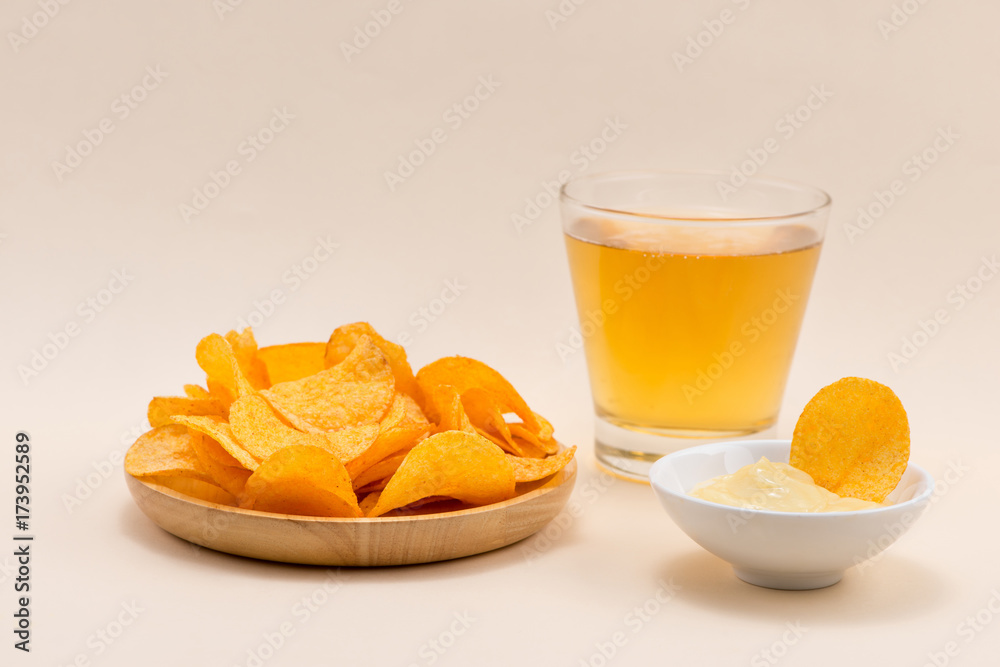 Cheese and onion potato chips with soft drink on table. Cheese and onion potato chips with soft drink on table.