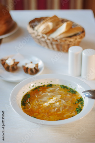 Delicious vegetable soup at the table of restaurant or cafe.