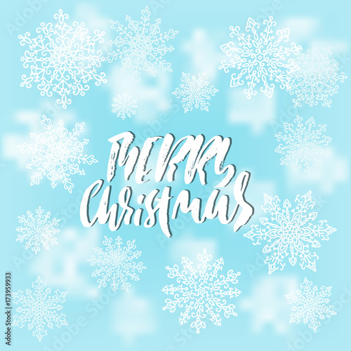 Merry Christmas handwritten lettering design on blur blue background. Vector illustration. White snowflakes winter pattern. EPS 10