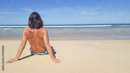 Portrait of young attractive woman having good time in the beach