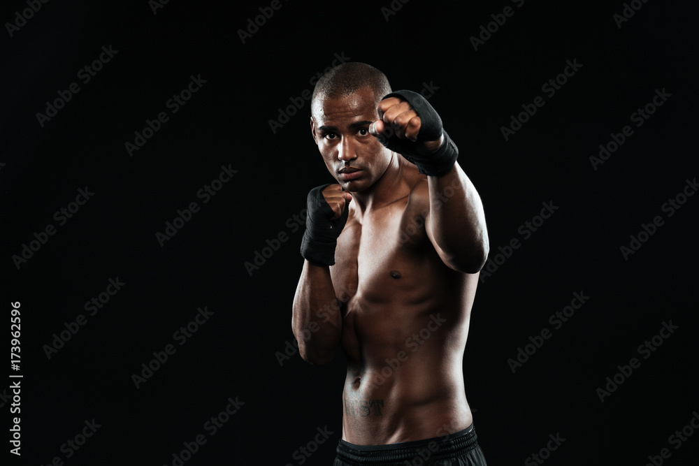 Afroamerican boxer with strong hands and clenched fists