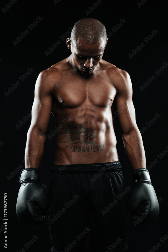 Portrait of young afroamerican boxer in gloves
