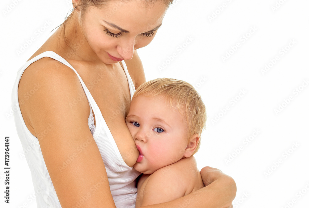 Young mother breastfeeds her baby. Breast-feeding. Young mother breastfeeds her baby. Breast-feeding.