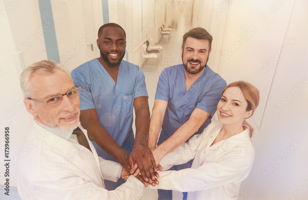 Obraz premium Happy workers doing teambuilding tasks