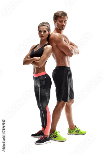 Obraz na płótnie Young sportsmen couple woman and man in studio on white background w salonie