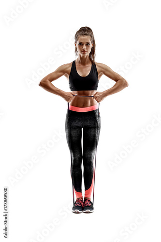 Woman exercising fitness resistance bands in studio silhouette isolated on white background photo