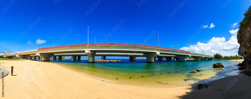 Beautiful panoramic view of bridge across the beach in clear blue sky day at Okinawa, Japan