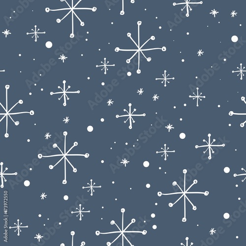 Vector seamless hand drawn snowflakes pattern. Winter background.