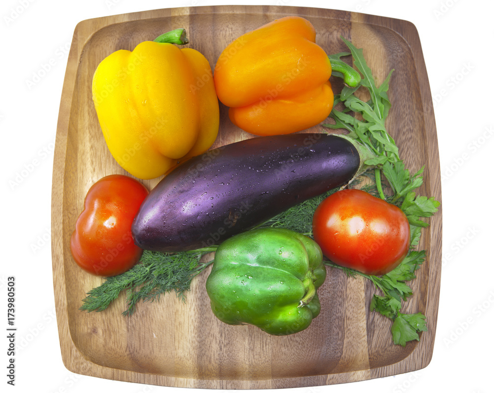 Sweet pepper, tomato, eggplant, parsley and fennel on a wooden tray.. Sweet pepper, tomato, eggplant, parsley and fennel on a wooden tray..