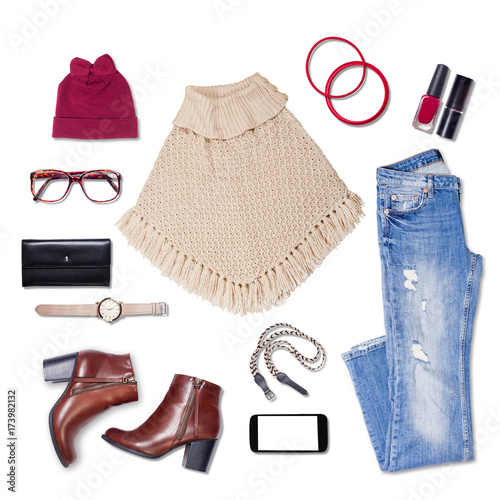 Overhead of clothes and woman accessories. Outfit of casual and modern woman on isolated white background.