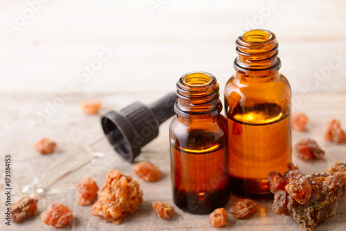 Myrrh essential oil on the wooden board