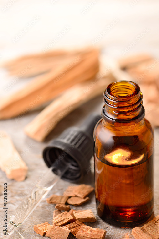 Sandalwood essential oil on the wooden board