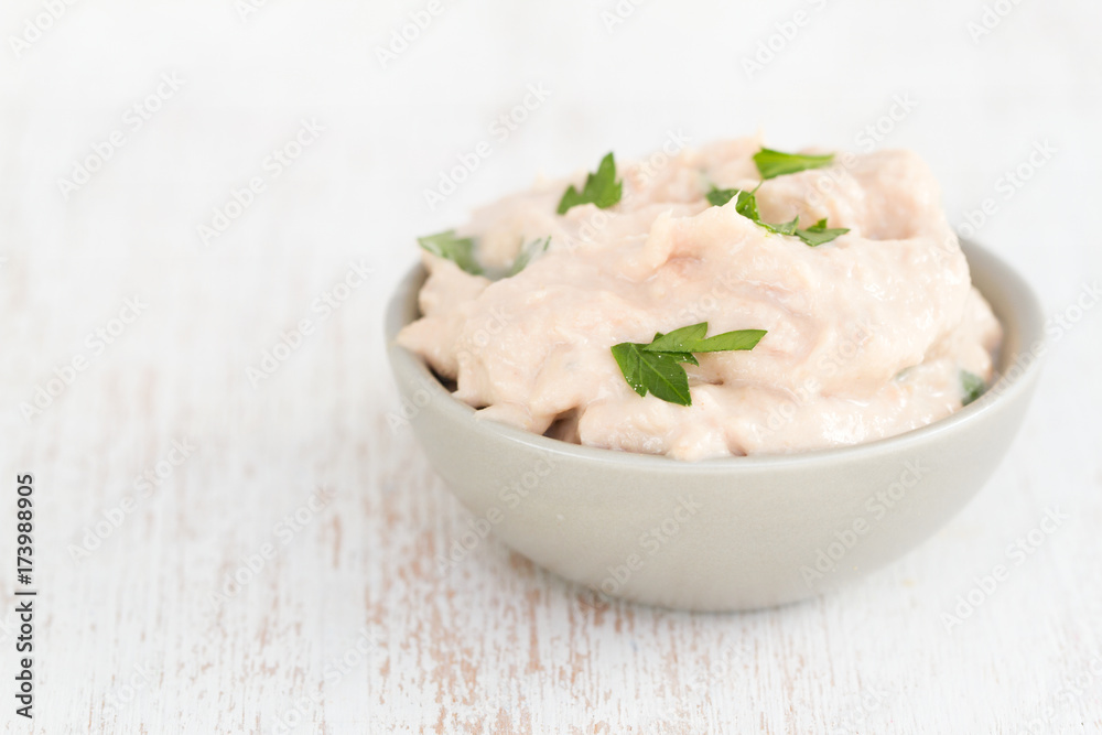 fish pate with herbs on white background fish pate with herbs on white background