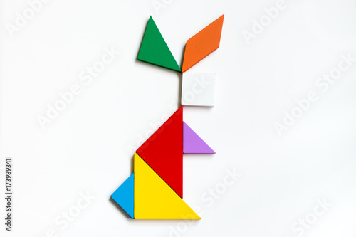 Free Download Colorful wood tangram puzzle in sitting rabbit shape on white background - GFXLoad