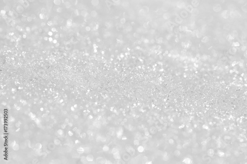 Texture of shiny white snow. Background for New Year's greeting card.