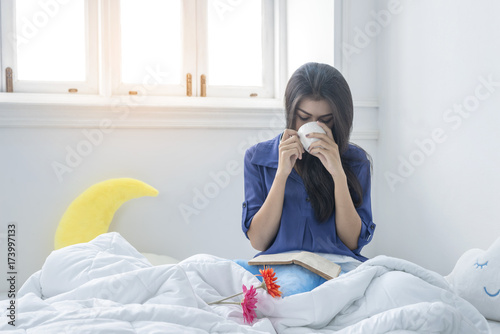 Beautiful women sitting on coffee in the morning.
