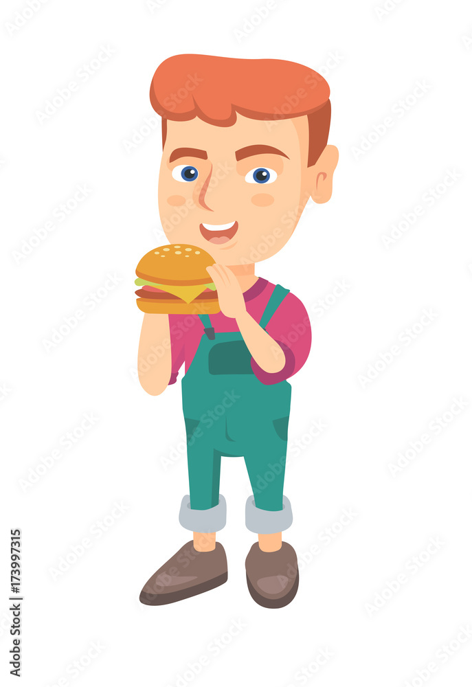 Little caucasian boy eating a hamburger with appetite. Cheerful boy ...