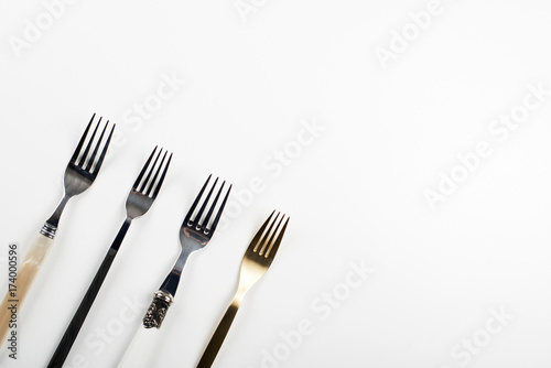 Forks on white background. Copy space.