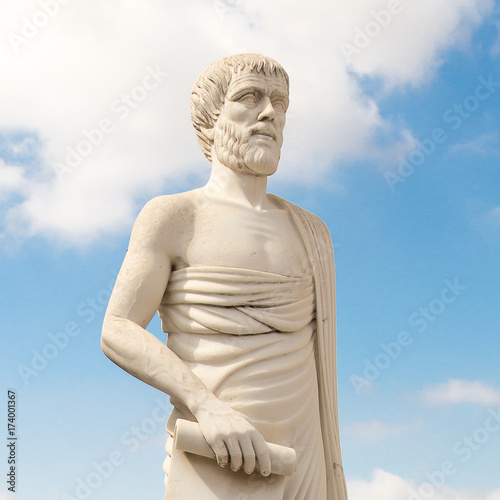 Greece. A monument to Aristotle against the background of the blue sky