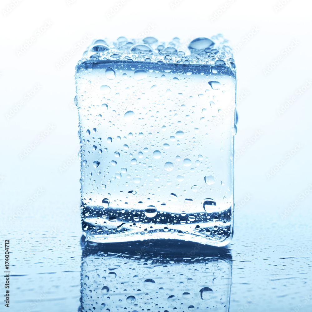 Transparent ice cube with reflection on white Transparent ice cube with reflection on white