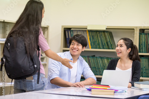 Group of Student meeting at the library with attractive smiling together. People with Education concept.