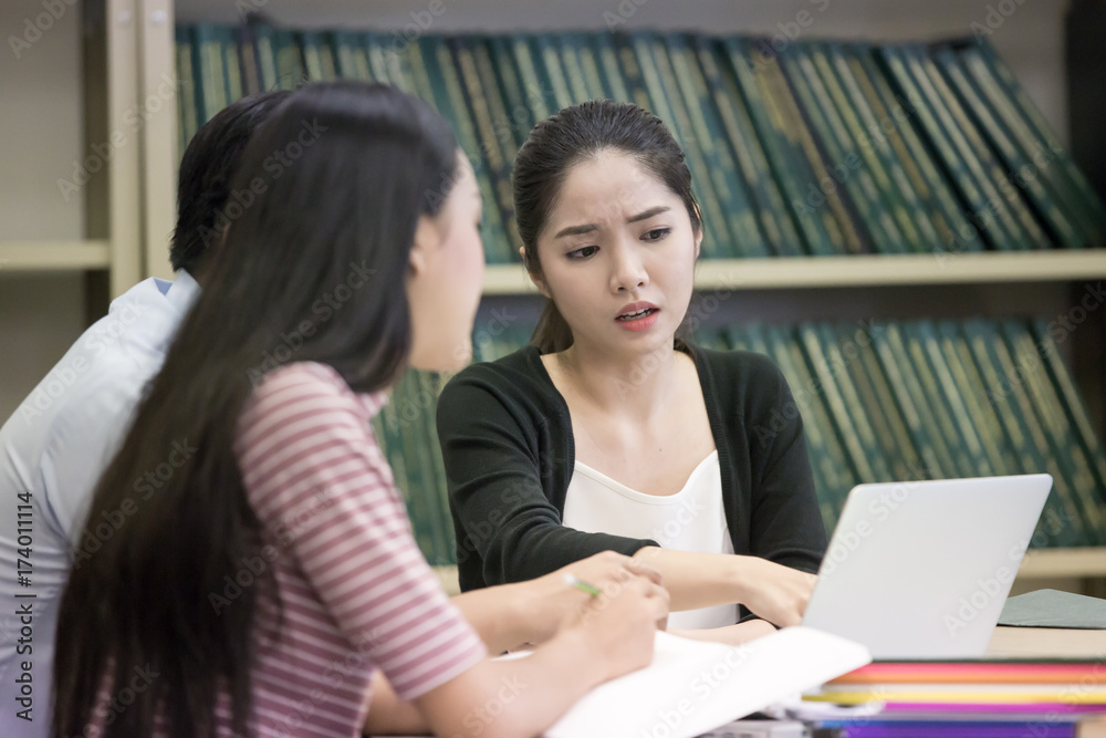 Group of Student Seaching information in the library together. People with Education concept. Group of Student Seaching information in the library together. People with Education concept.