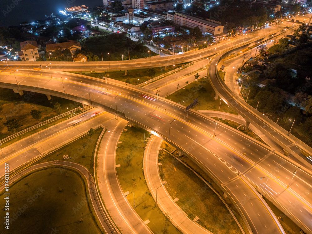The light on the road roundabout at night and the city in Bangkok, Thailand. Aerial view. Top view. Background scenic road. The light on the road roundabout at night and the city in Bangkok, Thailand. Aerial view. Top view. Background scenic road.