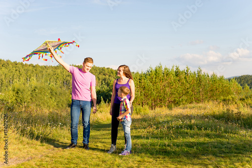 Family playing with a kite