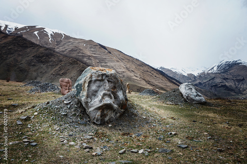 Stone face head in Sno valley in Georgia along the military road to Kazbegi photo