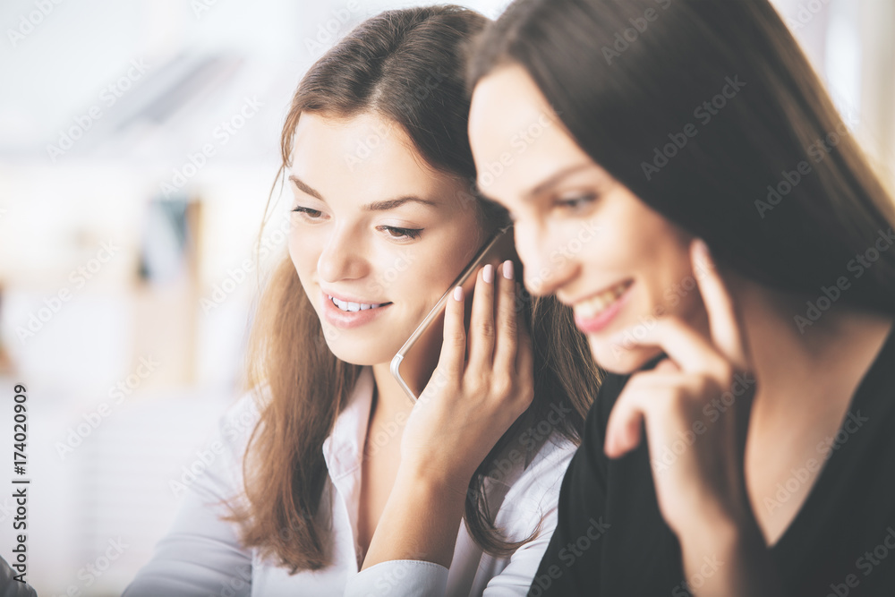 Attractive ladies talking on phone Attractive ladies talking on phone