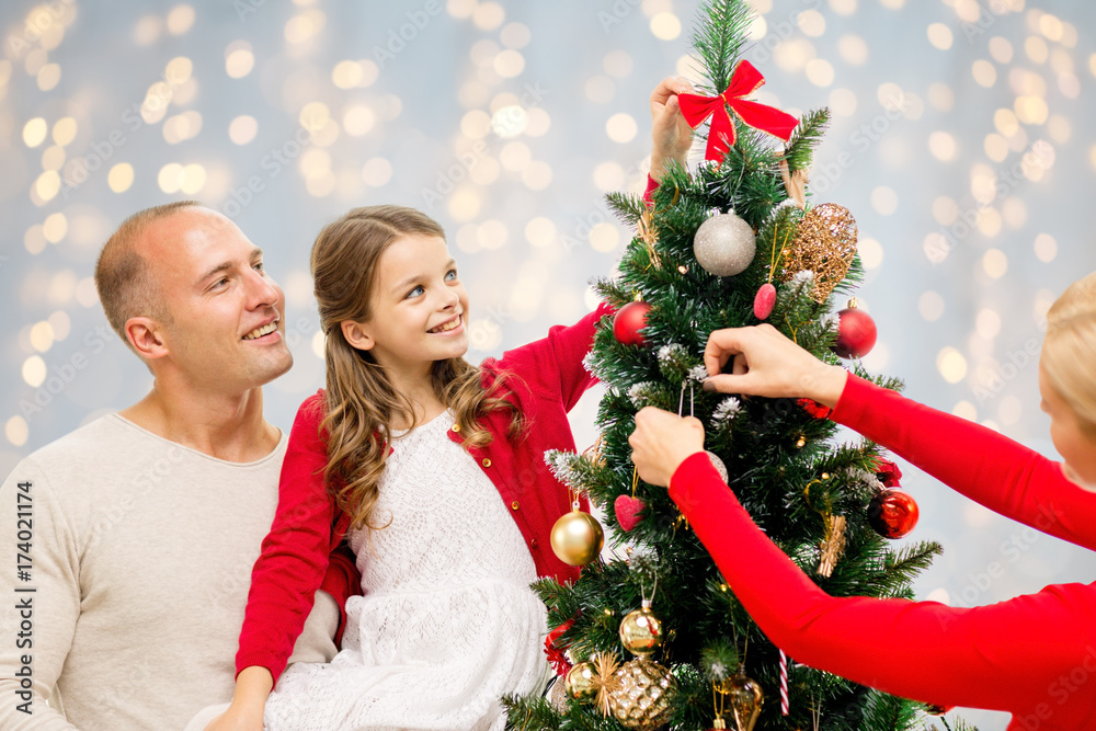 mother, father and daughter at christmas tree mother, father and daughter at christmas tree