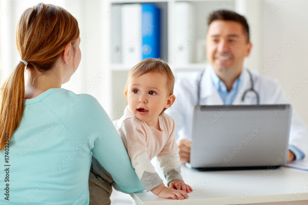 woman with baby and doctor with laptop at clinic woman with baby and doctor with laptop at clinic