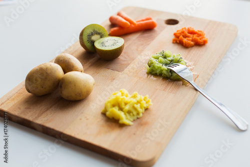 mashed fruits and vegetables with forks on board