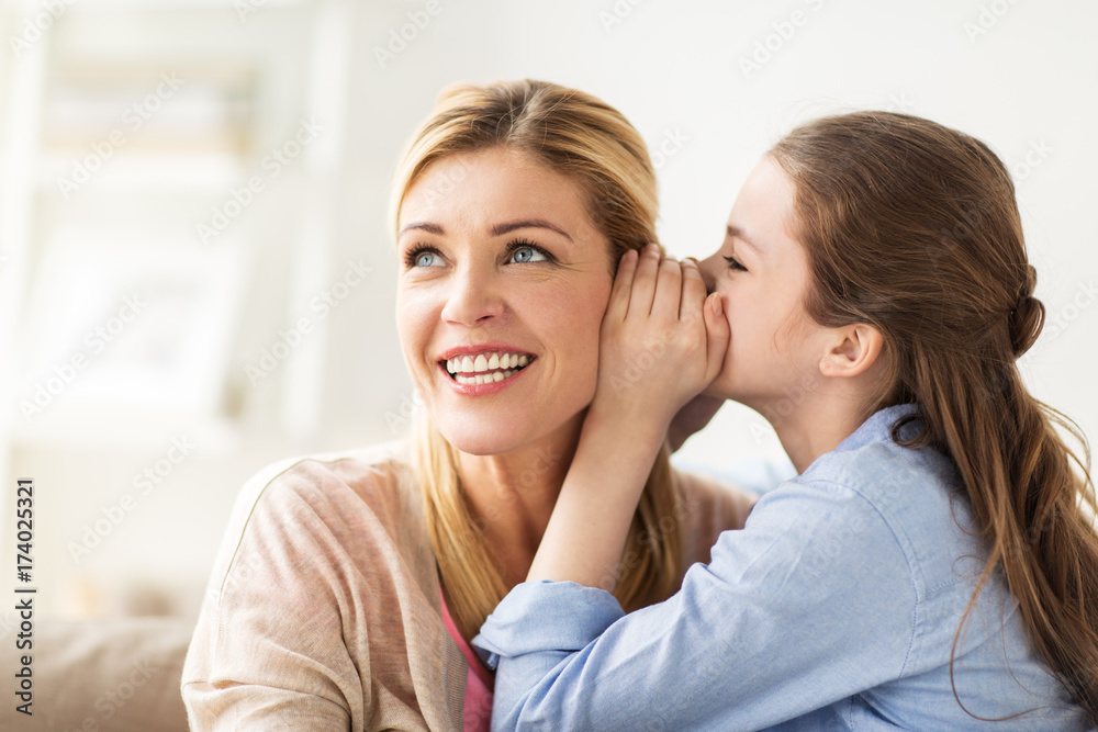 happy girl whispering secret to her mother at home
