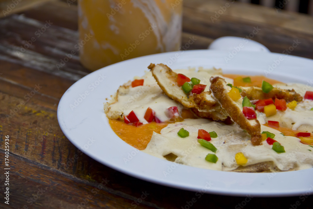 Breaded chicken slices and cheese sauce Breaded chicken slices and cheese sauce