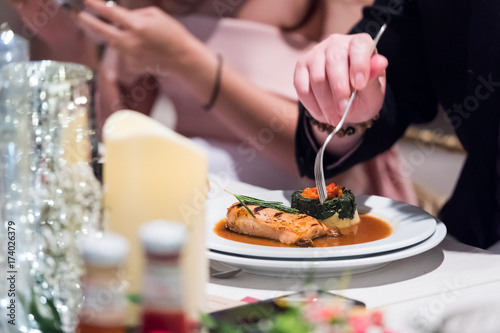 Cropped image of man eating in restaurant