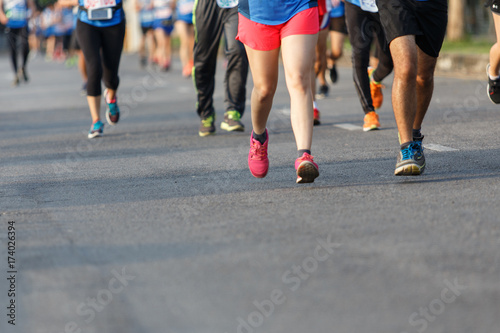 Marathon runners focus clear running shoes on the street. © Somkiat