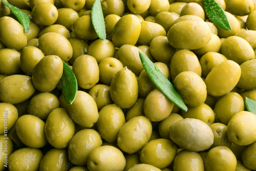Many green olives as background Many green olives as background