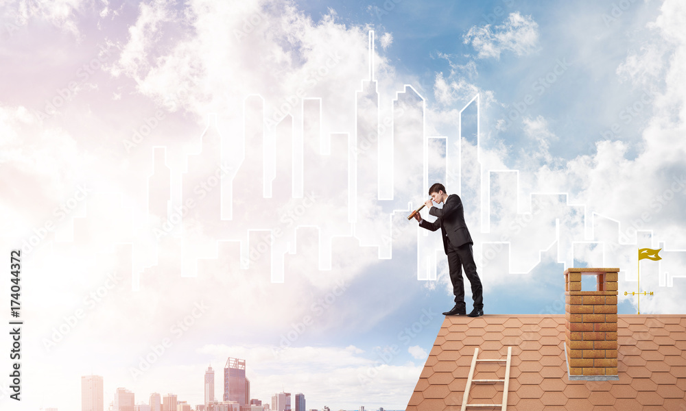 Engineer man standing on roof and looking in spyglass. Mixed media Engineer man standing on roof and looking in spyglass. Mixed media