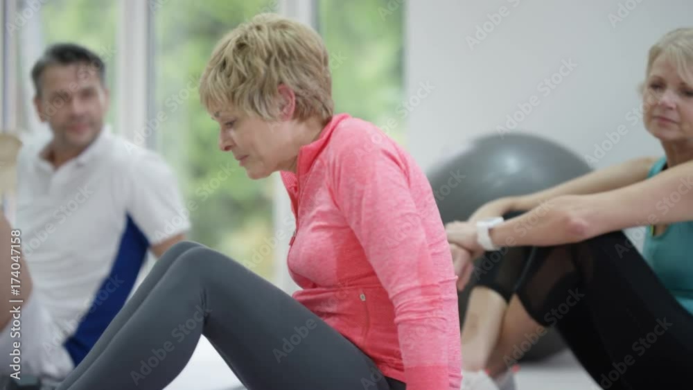 Healthy mature group working out together Healthy mature group working out together