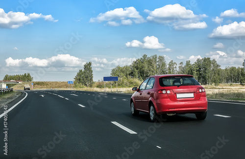 car goes on country highway © Yuri Bizgaimer
