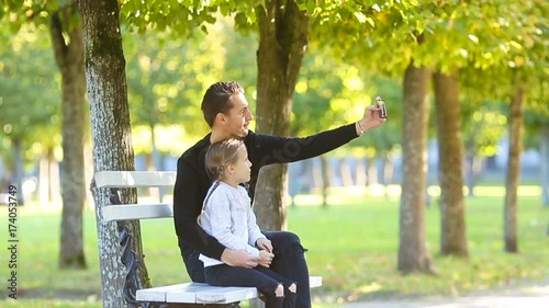 Happy family have fun takinf selfie on beautiful autumn day photo