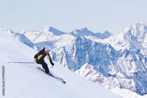 Skier in high mountains © destillat