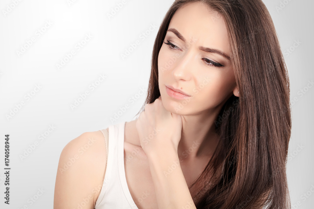 Tired Neck. Beautiful Young Woman Suffering From Neck Pain. Attractive Female Feeling Tired, Exhausted, Stressed. Girl Massaging Painful Neck With Hand. Body And Health Care Concept. High Resolution Tired Neck. Beautiful Young Woman Suffering From Neck Pain. Attractive Female Feeling Tired, Exhausted, Stressed. Girl Massaging Painful Neck With Hand. Body And Health Care Concept. High Resolution