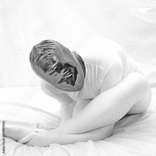 white zentai fetish girl in the bed alone photo