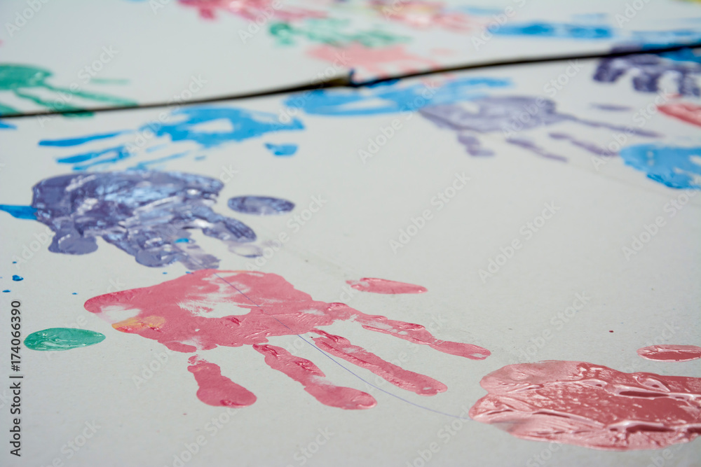 Hand make a trace colorful symbol on white paper background